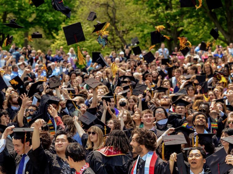 New Oberlin graduates celebrate at the conclusion of their commencement ceremony.