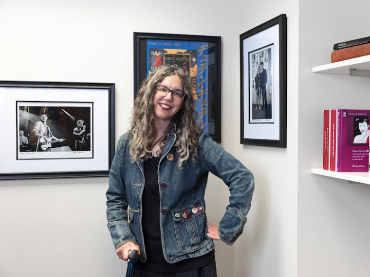 Annie Zaleski poses next to her published books.