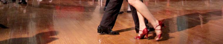 view of feet of two people dancing 