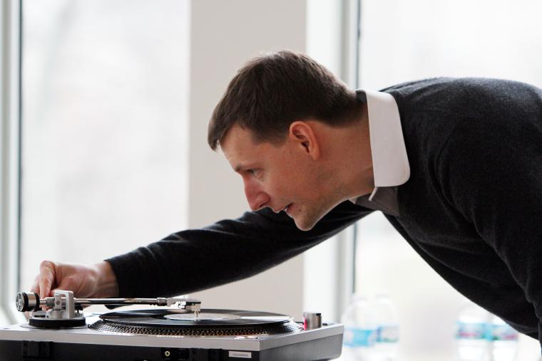 Chris Eldridge ’04 of the Punch Brothers spinning a record