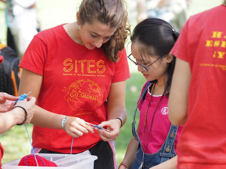 students in SITES program knitting small object