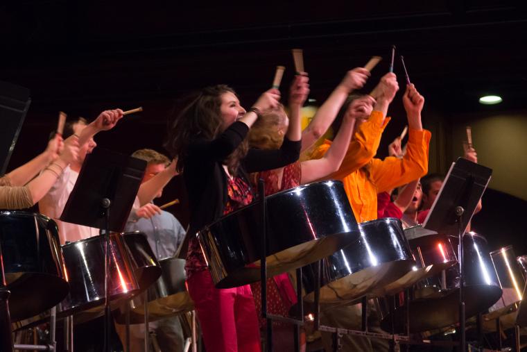 students performing on drums