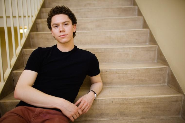 Henry Aberle sitting on a staircase
