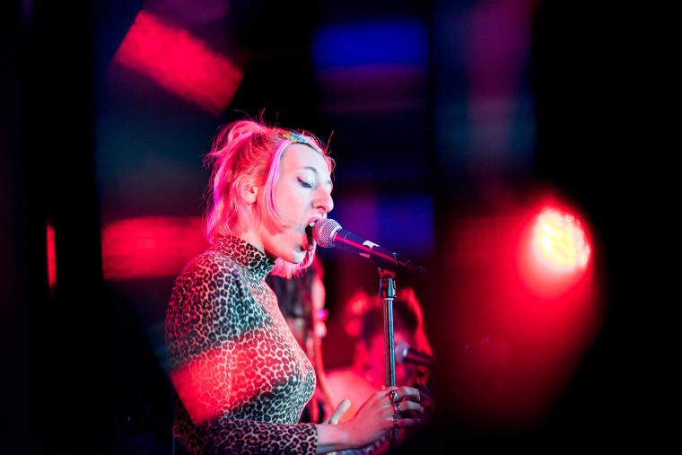 person signing into a microphone