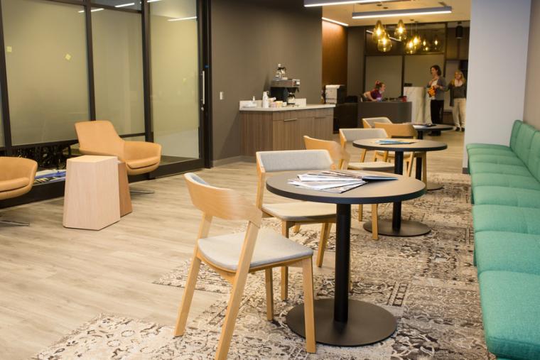 Photo of a room with chairs, couches, and tables