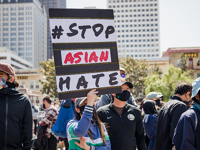Protestor holds a # Stop Asian Hate sign