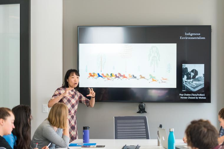 Professor teaching in StudIOC classroom