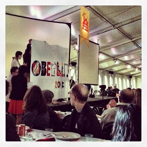 People hold up a homemade banner that reads 'Oberlin 2013'