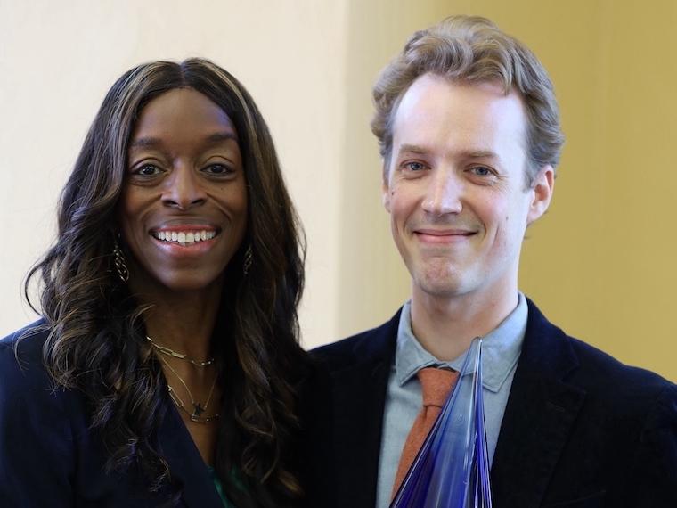 President Ambar stands with Mathias Reed