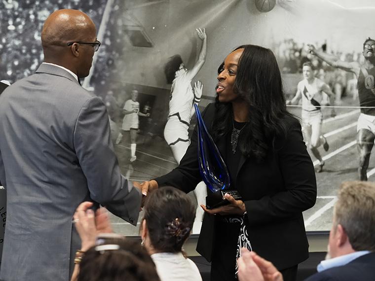 Leondist Duvall accepts YB Staff Award from President Ambar