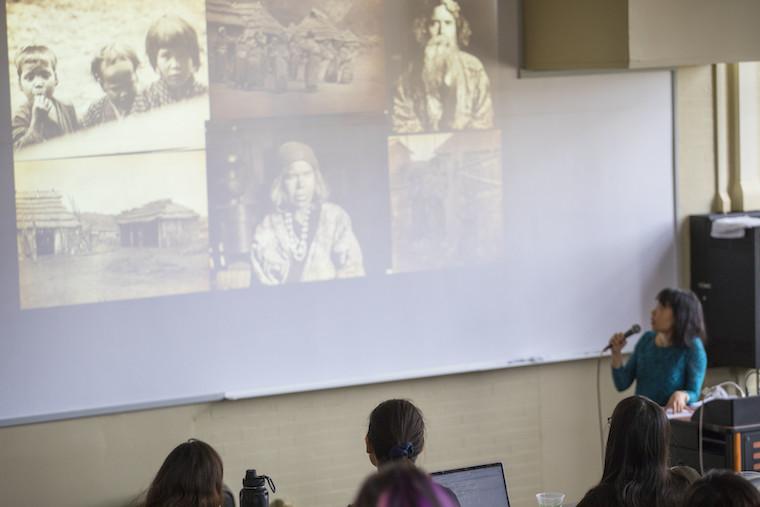 Woman presenting slide show of pictures,