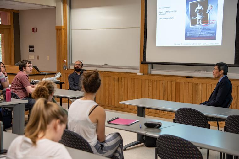 Students and professor in classroom.