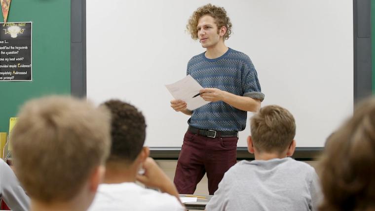 Man teaching in classroom.