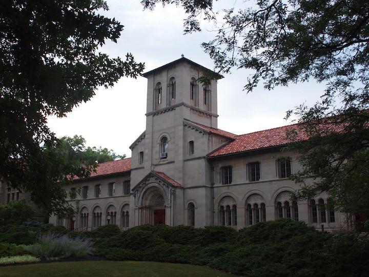 A long building with a bell tower in the center.