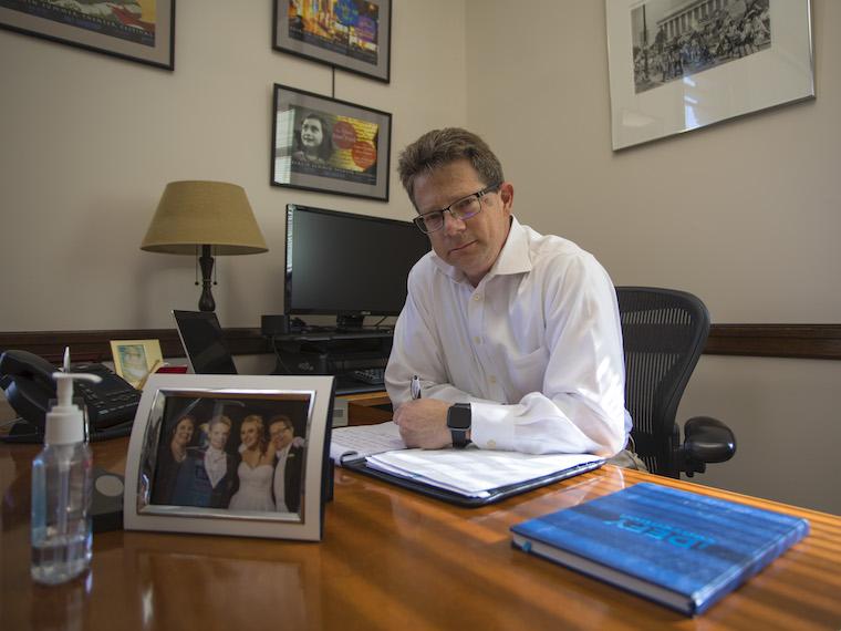 david hertz sitting behind desk in his office.