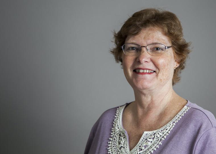 A portrait of Jackie Fortino wearing a sweater.