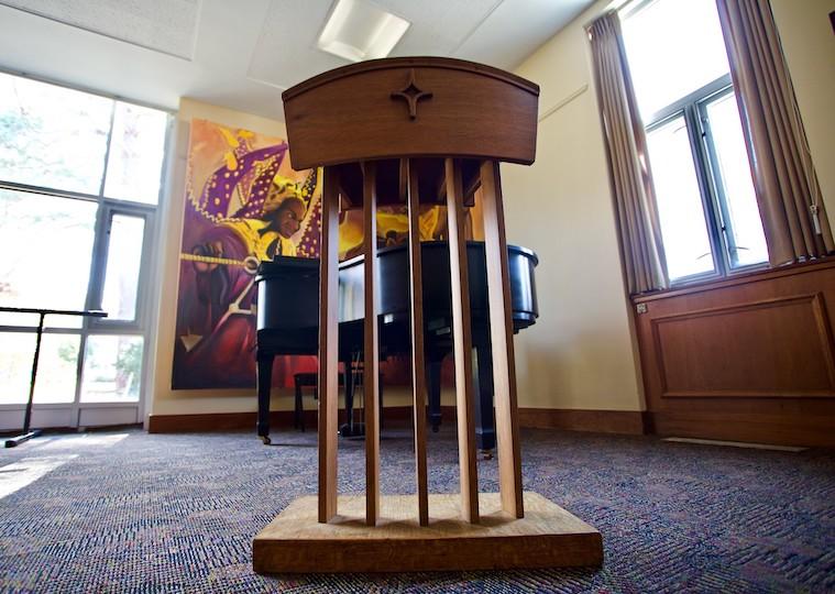 A picture of a podium in an empty room.