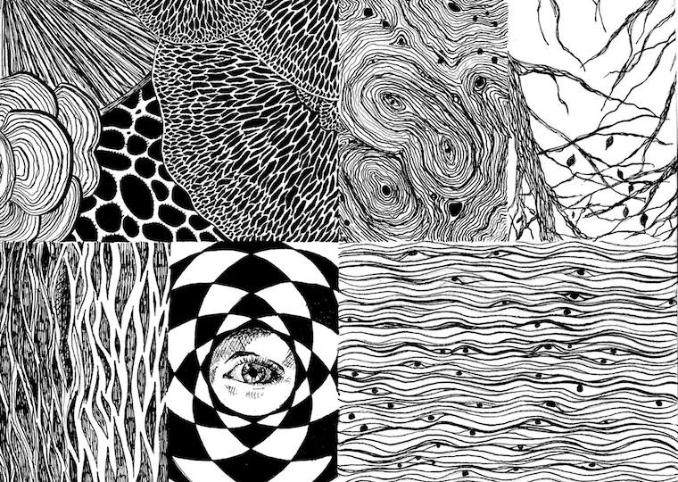 A woodblock print with several line designs including an eye.