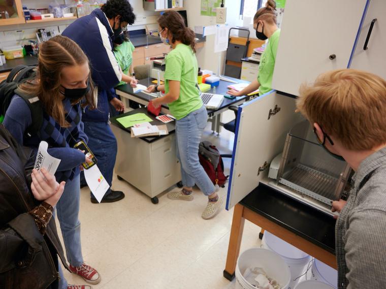 Several students visit a science lab.