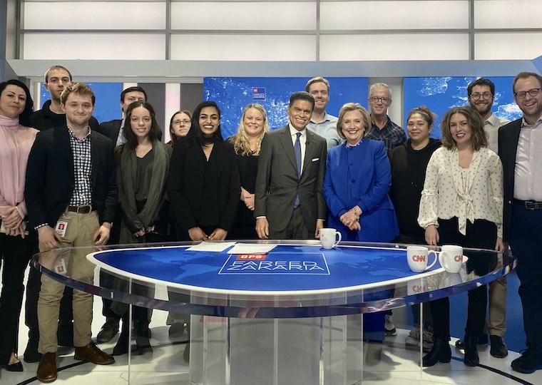 A group photo on the set of a CNN talk show.