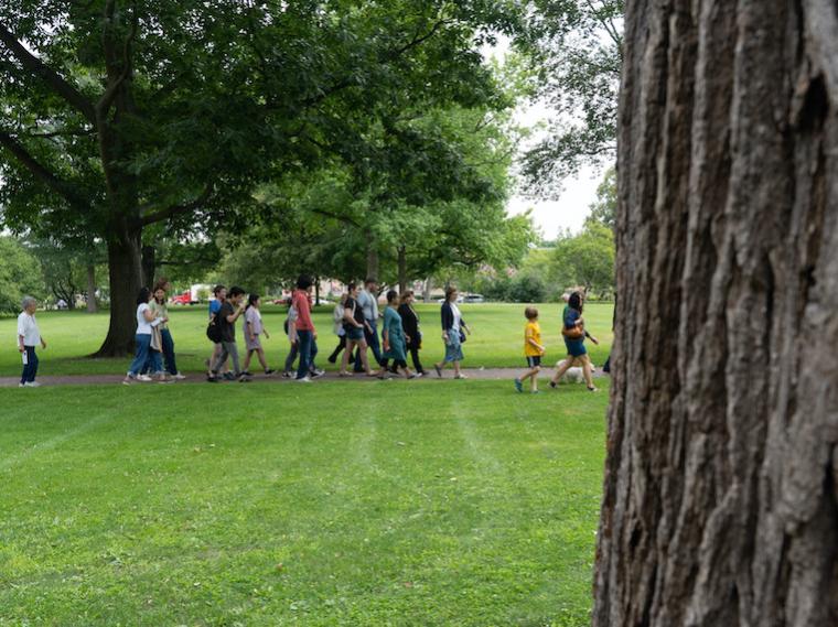 A group of people on a tour in a park.