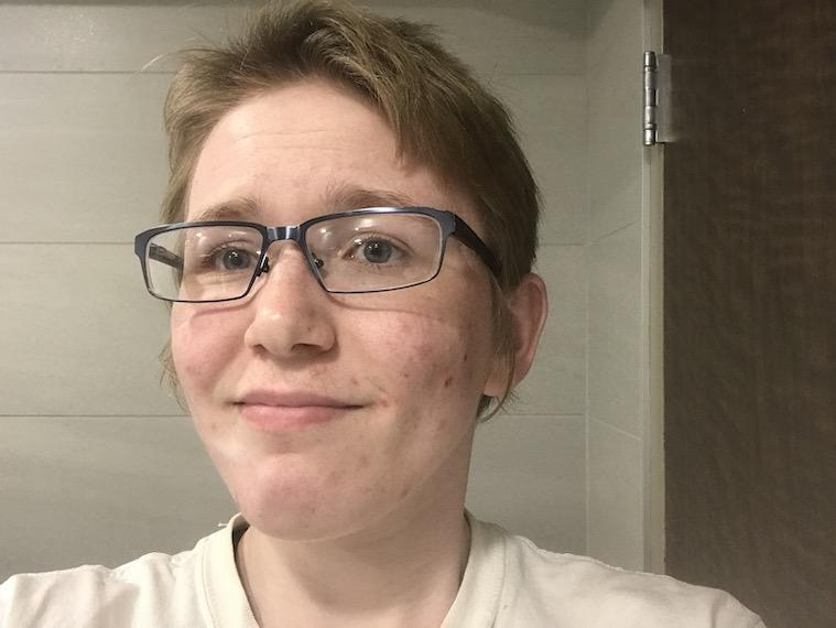 A portrait of a male student wearing lasses.