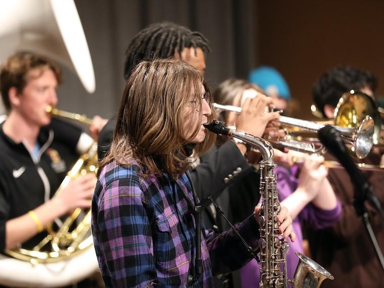 A student plays the saxophone