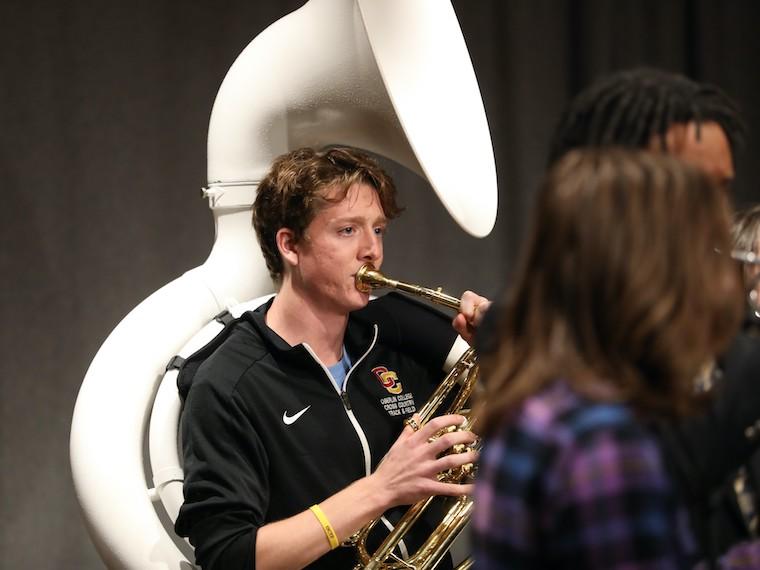 A student plays a tuba