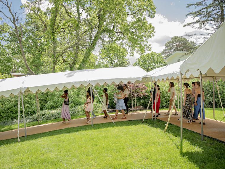 Students along a covered platform.