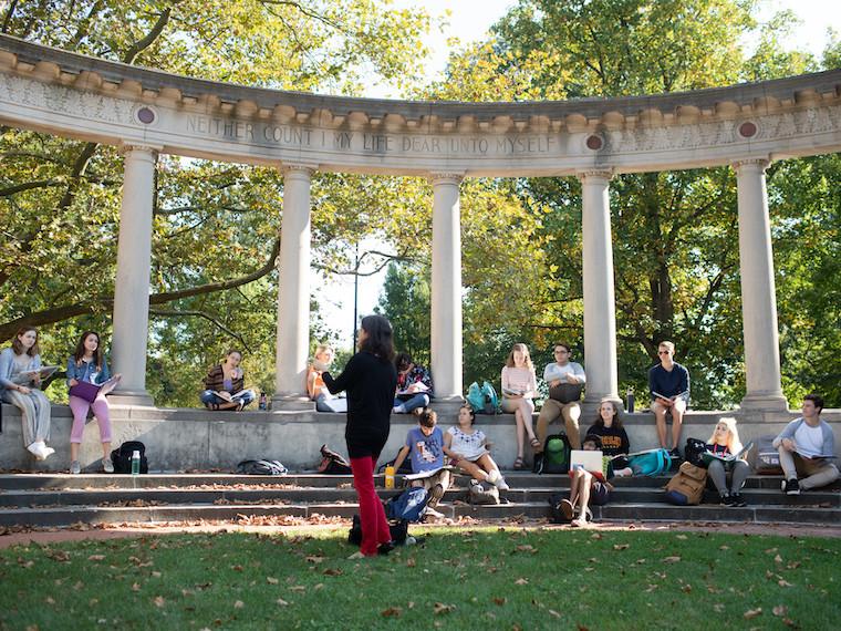 A teacher leads an outdoor class.
