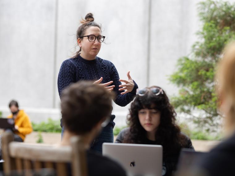 A professor, Sheera Talpaz, teaches a class in the King courtyard.