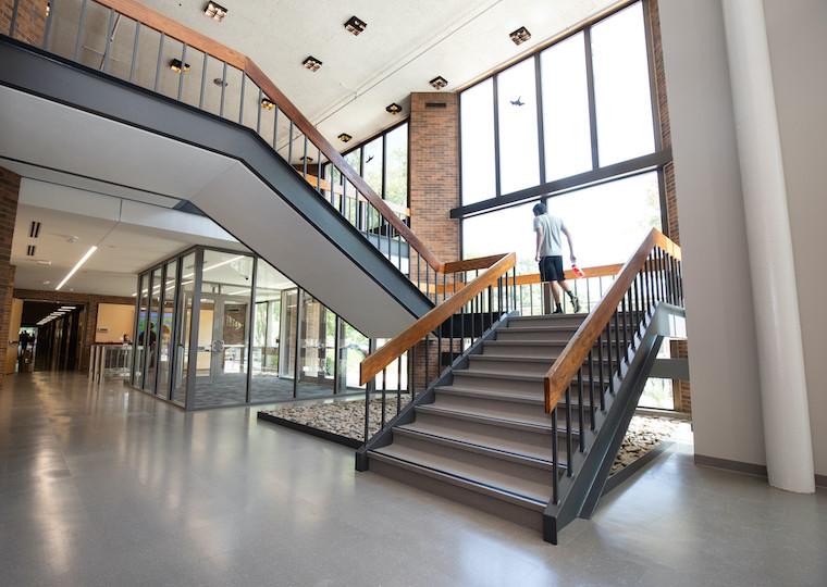 A long mid-century staircase in a gym.
