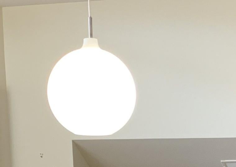 Large round light hanging from ceiling