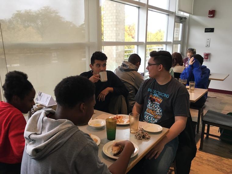 Students having lunch together. 