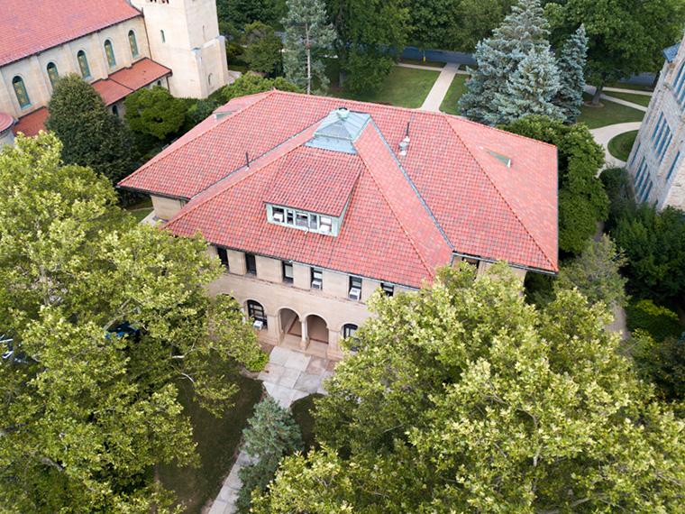 Aerial view of a building with a red tiled roof.