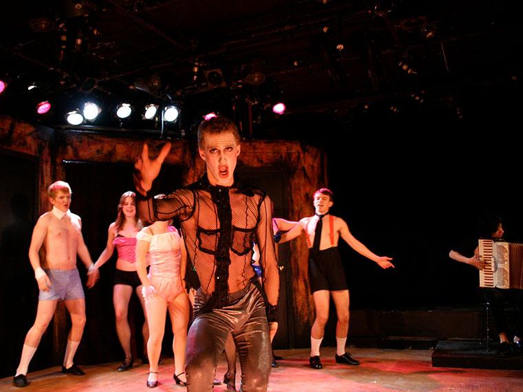 Foreground: Raphael Sacks as Master of Ceremonies. Background: Sean Lucius as Bobby, Holly Heidt as Rosie, Aaron Kokotek as Victor/Sailor in Cabaret, by John Kander and Freb Ebb, Directed by Joshua Sobel, Feb 14-17, 2008