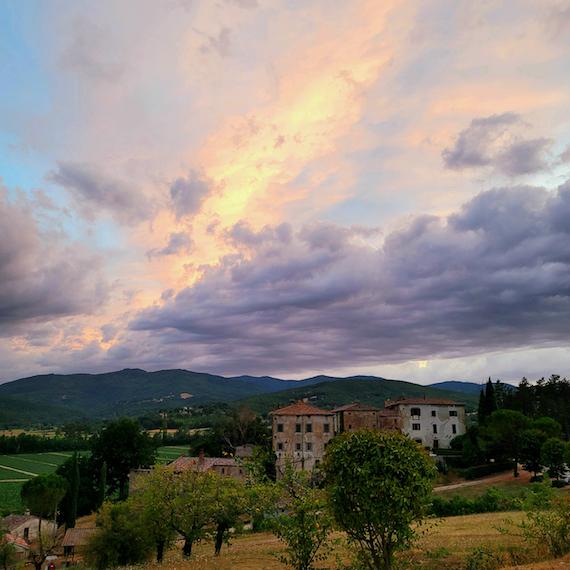A view of the Castello di Sorci during a sunset.