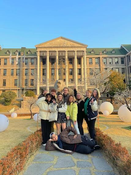 Our Korean Language Class, 9 students, standing and smiling together in front of the main administrative building at Hanyang University.