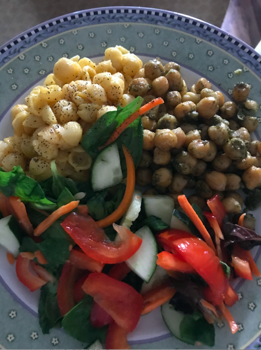 plate of food with Mac and cheese, chickpeas, and salad
