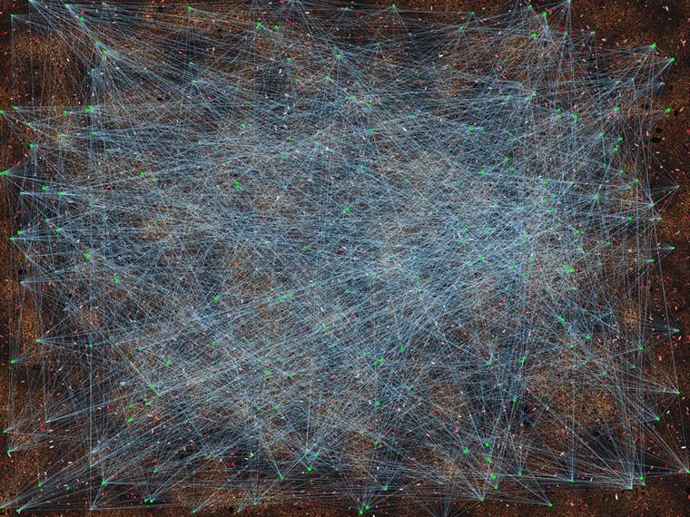 A complex digital visualization of an interconnected network resembling a web of glowing blue lines crisscrossing a dark background.